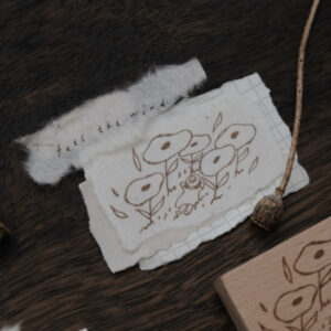 BigHands – Girl in Flower Bed – Feel the Wind – Stamp