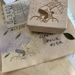 SOM Studio – Even if It Rains – Cycling in the Rain – Stamp